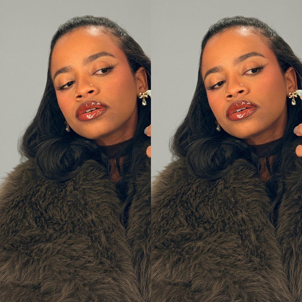 Woman wearing a dark fur coat in front of a mirror.

